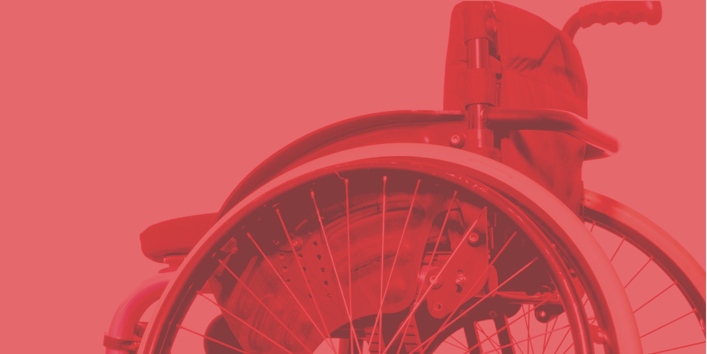 Side profile of a wheelchair with red overlay.